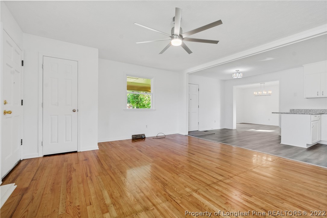 77 Hiawatha Road Pembroke, NC 28372 - Photo 8 of 30 a view of an empty room and window with wooden floor