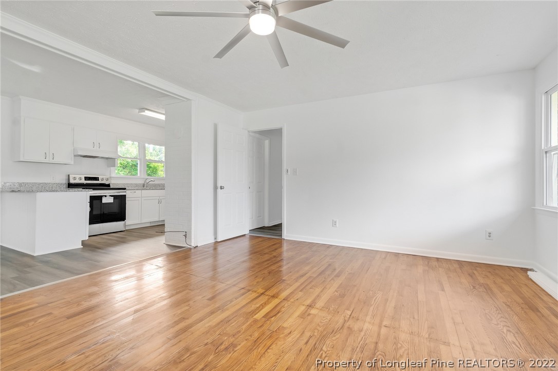 77 Hiawatha Road Pembroke, NC 28372 - Photo 9 of 30 a view of an empty room with window and wooden floor