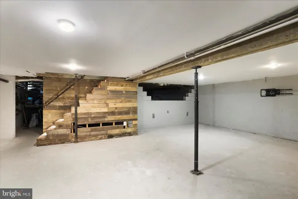 a room with gym equipment and a table