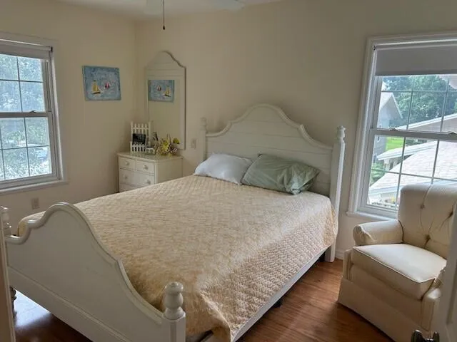 a bedroom with a bed window and couch