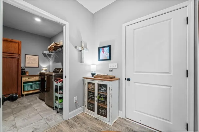 a view of a kitchen with fridge and rack