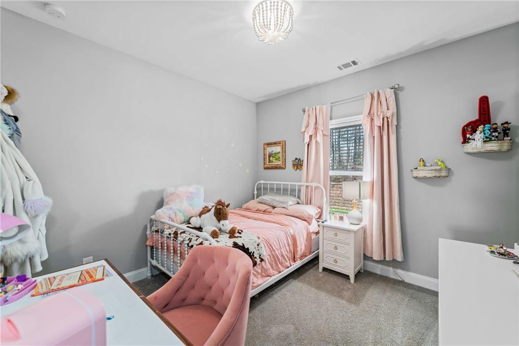 104 Federal Path Temple, GA 30179 - Photo 21 of 32 a bedroom with a bed and a window