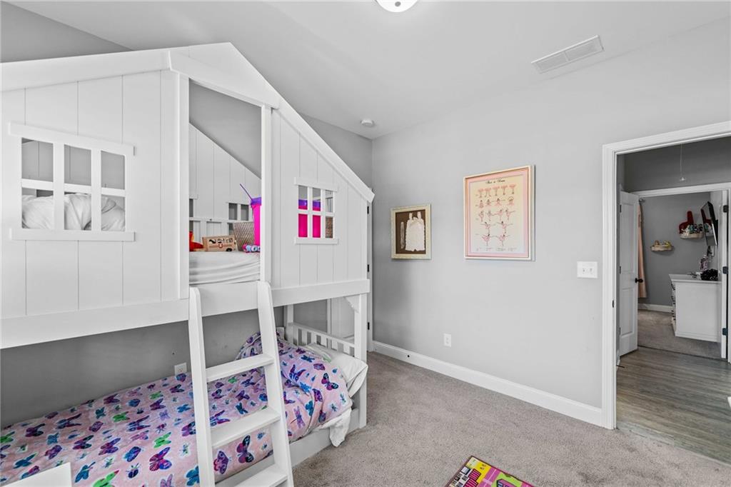 104 Federal Path Temple, GA 30179 - Photo 23 of 32 a bed room with a bed and a chair