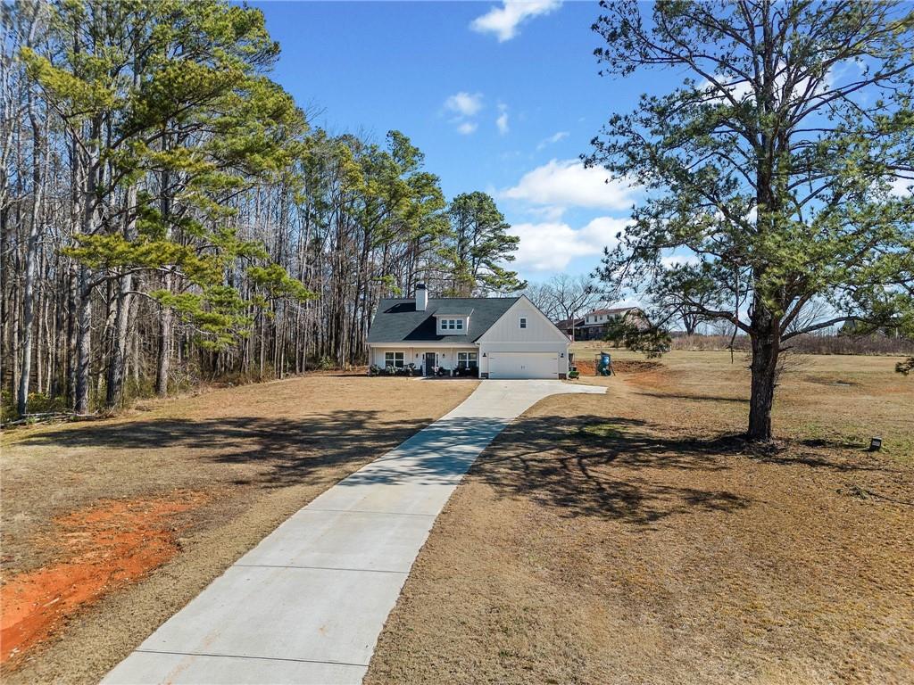 104 Federal Path Temple, GA 30179 - Photo 28 of 32 a view of dirt yard with a large tree
