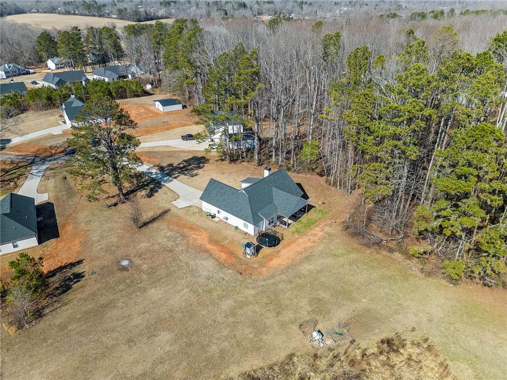 104 Federal Path Temple, GA 30179 - Photo 30 of 32 an aerial view of a swimming pool with lawn chairs and large trees