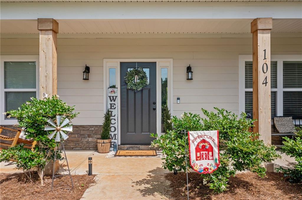 104 Federal Path Temple, GA 30179 - Photo 3 of 32 a front view of a house with potted plants