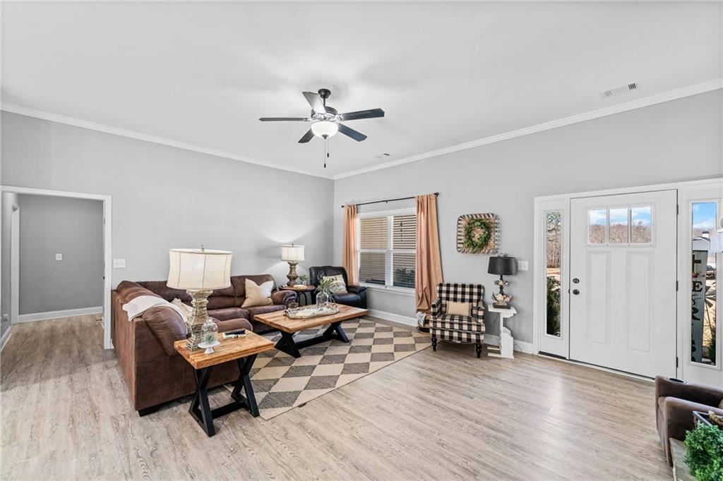 104 Federal Path Temple, GA 30179 - Photo 7 of 32 a living room with furniture and wooden floor