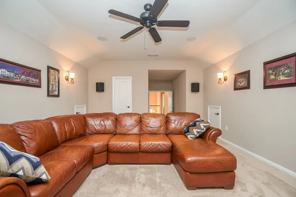 a view of living room with couch and a window