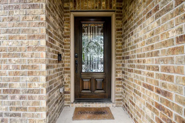 a view of a door of the house with a door