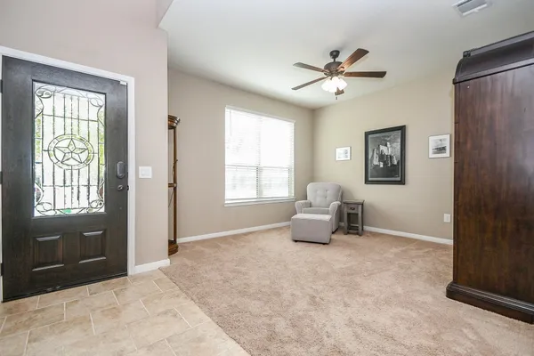 a living room with furniture and a window