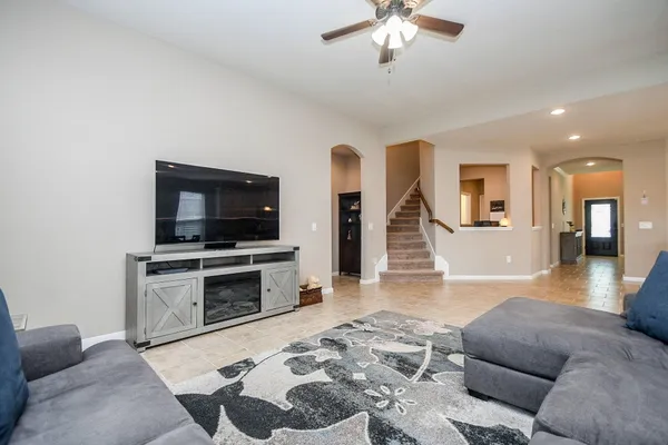 a living room with furniture and a flat screen tv