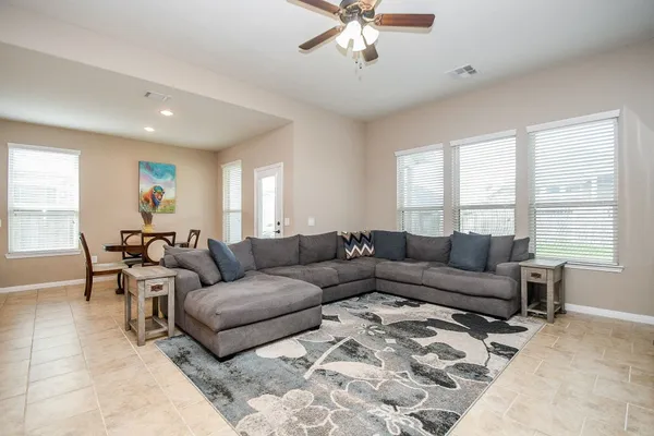 a living room with furniture and a large window