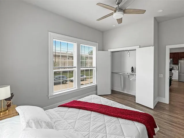 a bedroom with a bed and a window