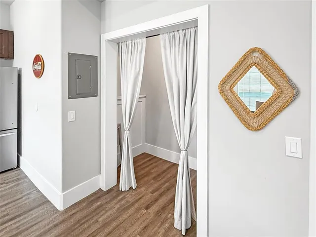 a view of front door with wooden floor