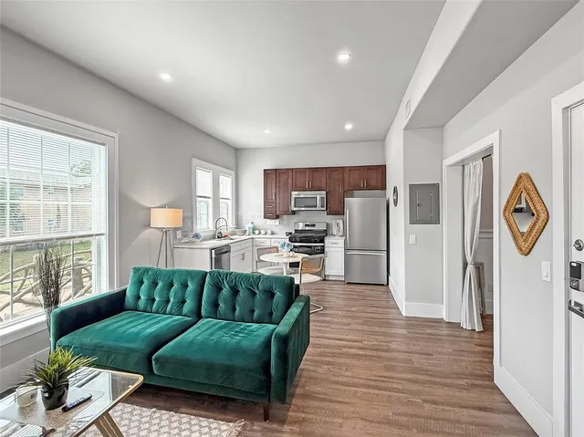 a living room with furniture and a large window