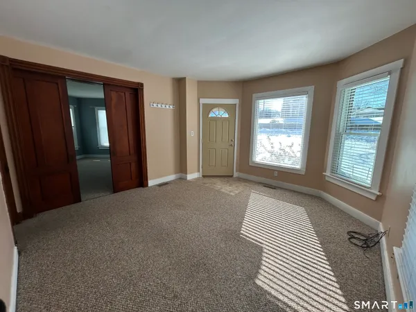 a view of empty room with windows