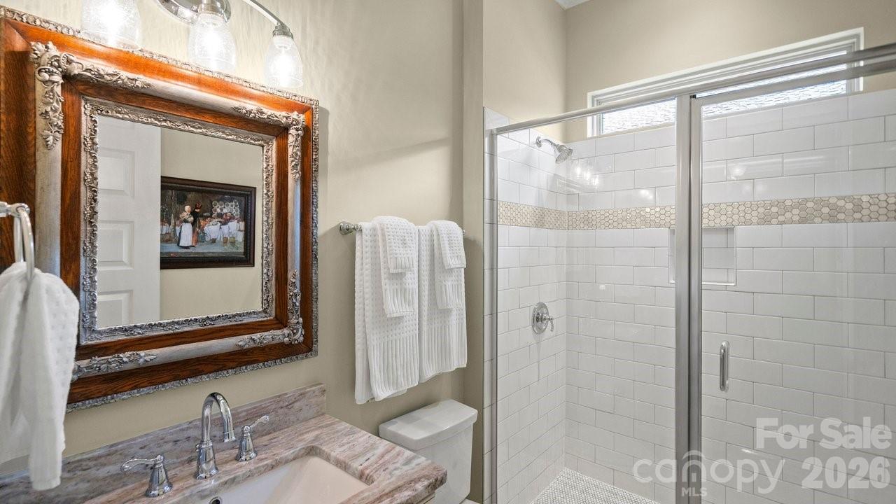 4854 Looking Glass Trail Denver, NC 28037 - Photo 43 of 48 a bathroom with a shower a mirror and a sink