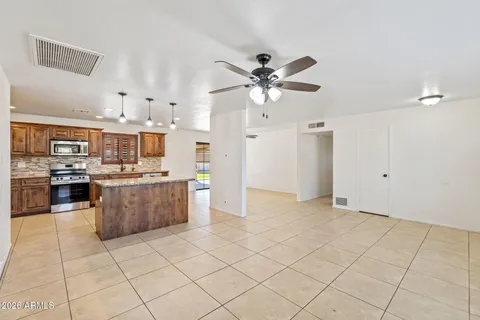 a view of kitchen with stainless steel appliances cabinets and a counter top space