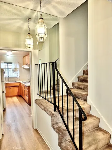 a white toilet sitting next to a shower