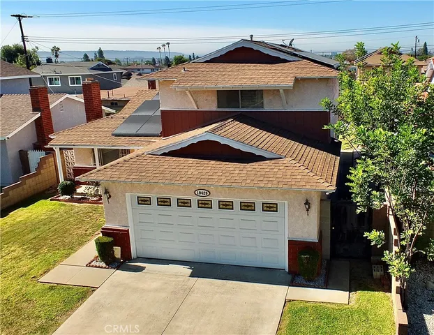 a view of a hallway with a white walls and a fireplace
