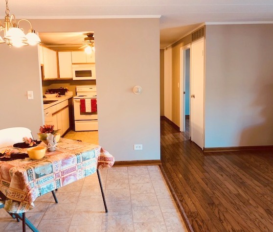 1102 Springinsguth Road, Unit 1A Schaumburg, IL 60193 - Photo 2 of 14 a view of workspace with wooden floor