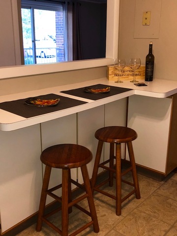 1102 Springinsguth Road, Unit 1A Schaumburg, IL 60193 - Photo 7 of 14 a kitchen with a table and chairs in it