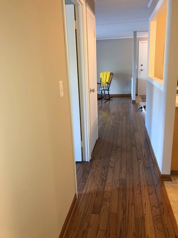 1102 Springinsguth Road, Unit 1A Schaumburg, IL 60193 - Photo 8 of 14 a view of hallway with wooden floor