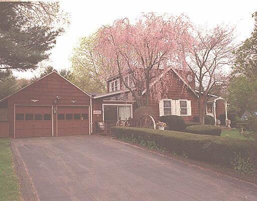 91 West Norwalk Road Norwalk, CT 06850 - Photo 1 of 1 front view of a house with a dry yard