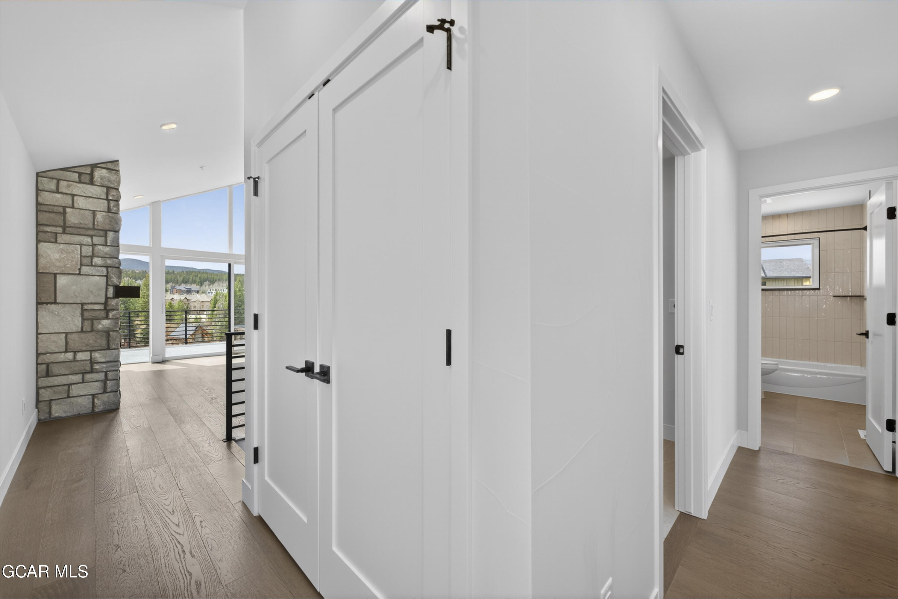 119 Wheeler Road Winter Park, CO 80482 - Photo 19 of 51 a view of a hallway view with wooden floor and living room