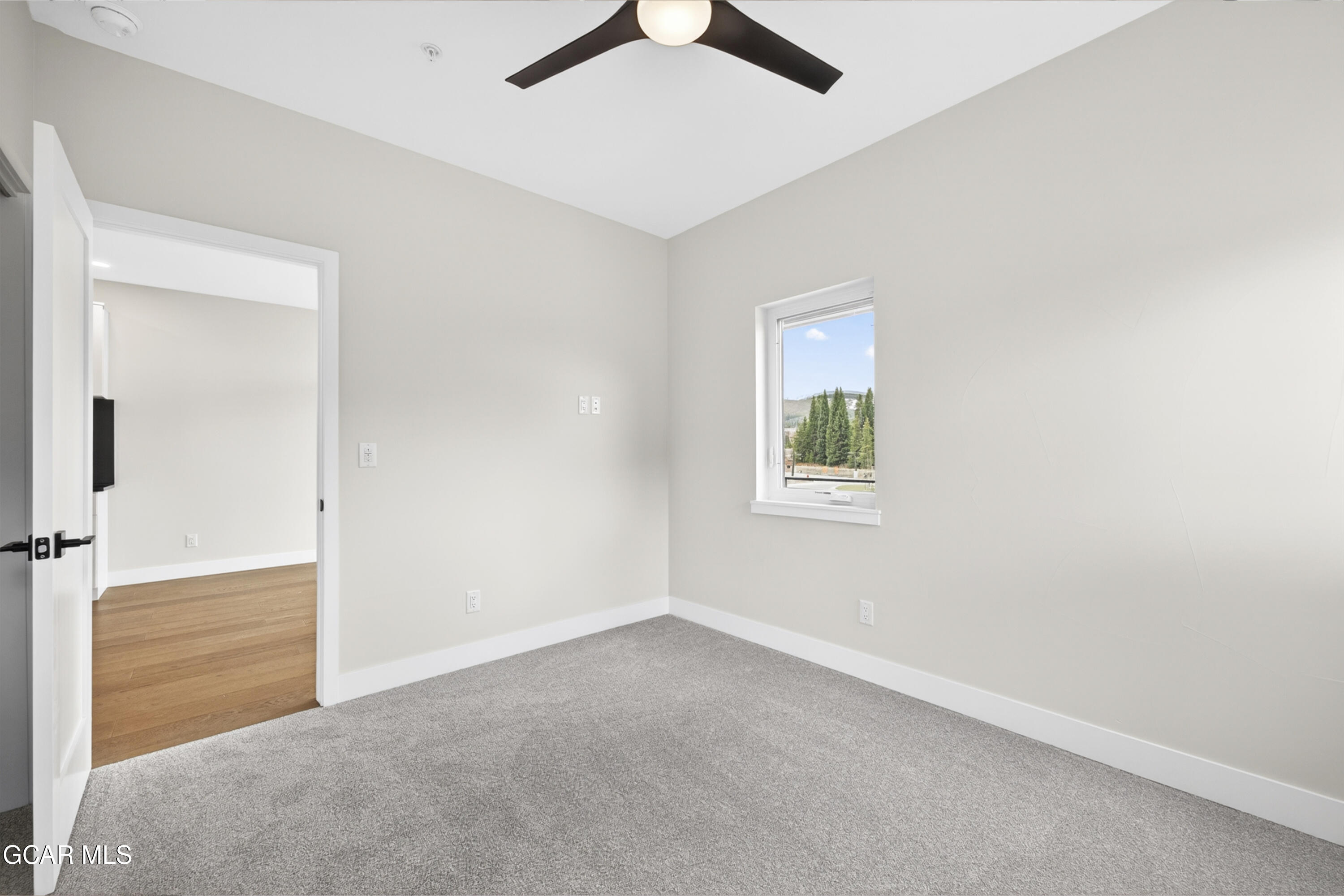 119 Wheeler Road Winter Park, CO 80482 - Photo 46 of 51 an empty room with fan and windows