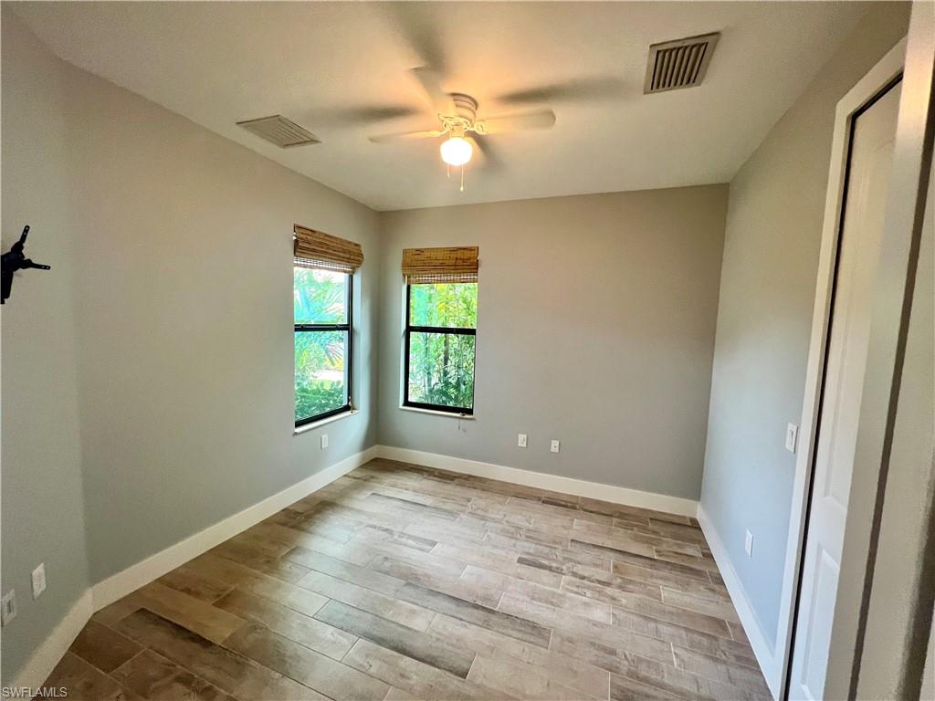 3128 Woodside Avenue Naples, FL 34112 - Photo 12 of 16 a view of an empty room with a window