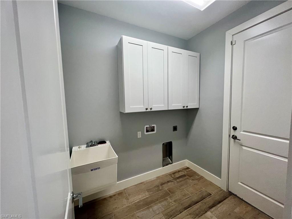 3128 Woodside Avenue Naples, FL 34112 - Photo 14 of 16 a room with storage and utility