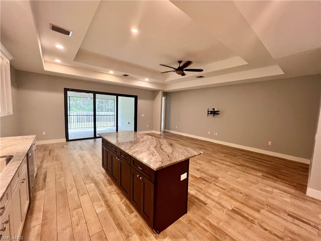 3128 Woodside Avenue Naples, FL 34112 - Photo 5 of 16 a living room with hard wood floors and a wooden floors
