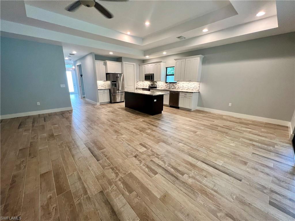 3128 Woodside Avenue Naples, FL 34112 - Photo 6 of 16 a large room with kitchen view