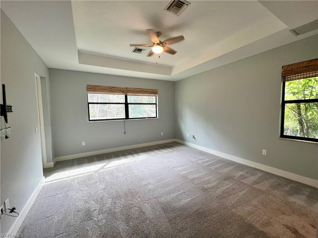 3128 Woodside Avenue Naples, FL 34112 - Photo 7 of 16 wooden floor in an empty room with a window