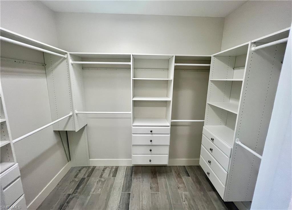 3128 Woodside Avenue Naples, FL 34112 - Photo 9 of 16 a view of walk in closet with empty racks