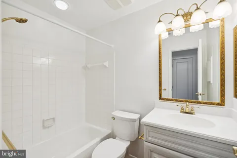 a bathroom with a sink a toilet and a bathtub