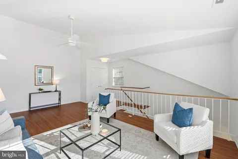 a living room with furniture and a rug