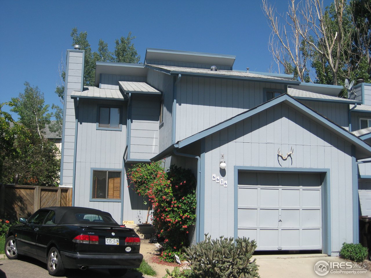 6616 Kalua Road Boulder, CO 80301 - Photo 1 of 18 a view of a car parked in front of a house
