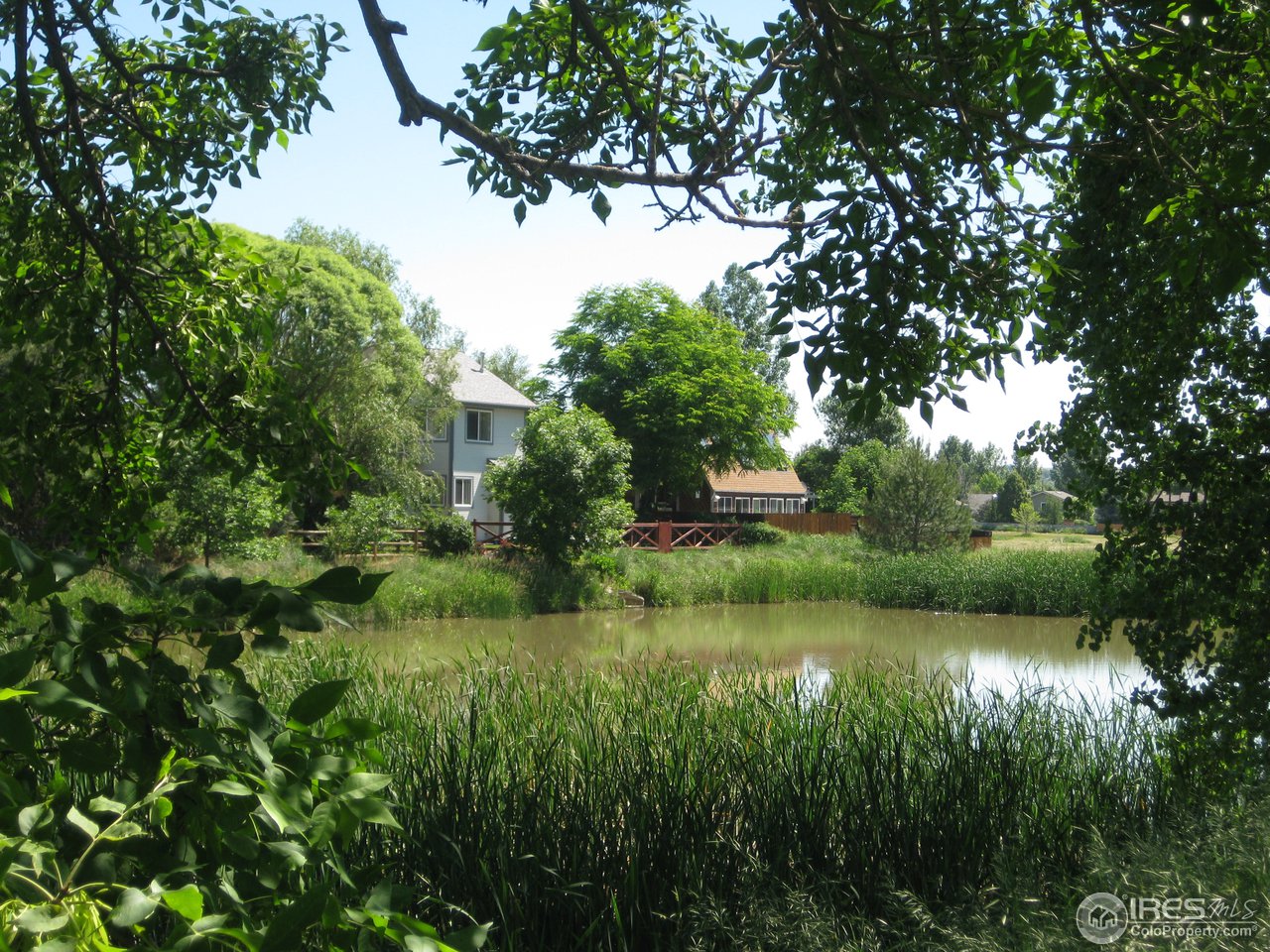 6616 Kalua Road Boulder, CO 80301 - Photo 15 of 18 a view of a lake with houses in back