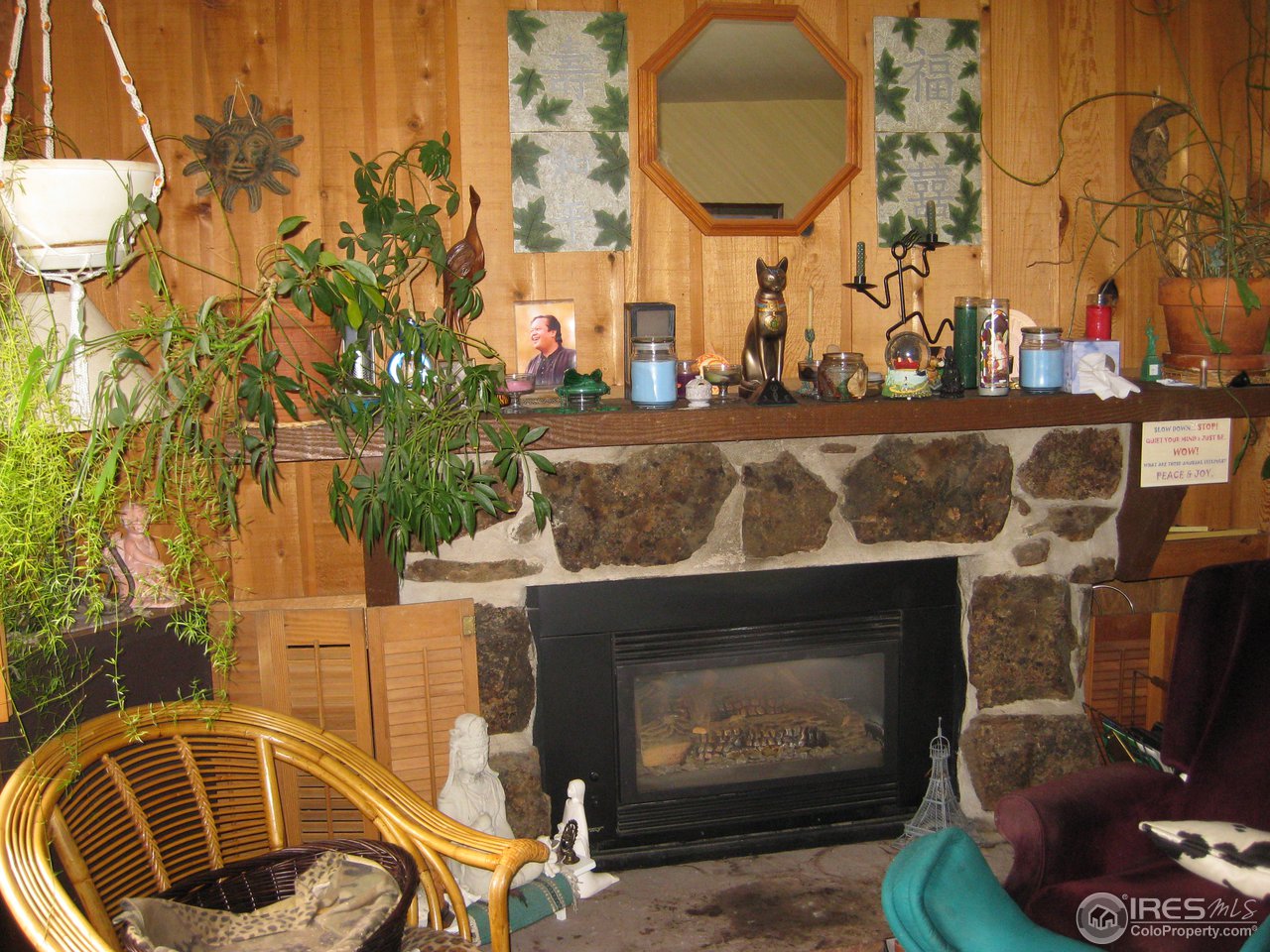 6616 Kalua Road Boulder, CO 80301 - Photo 4 of 18 a front view of a fireplace with table and chairs