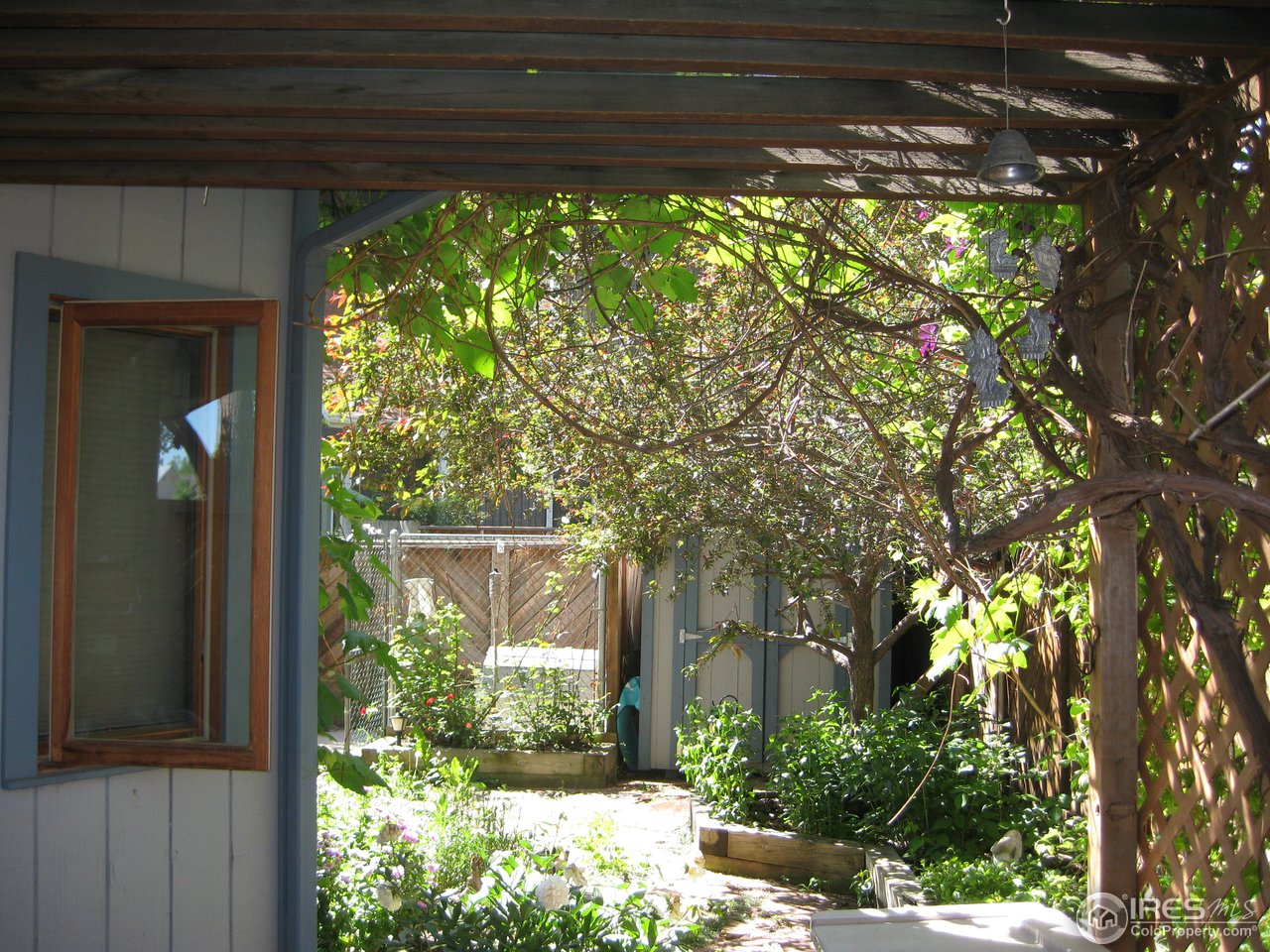 6616 Kalua Road Boulder, CO 80301 - Photo 8 of 18 a view of a porch with a yard