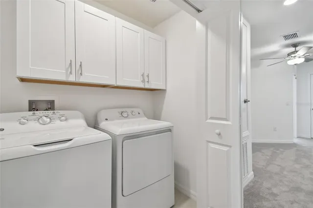 a bathroom with a granite countertop sink and shower