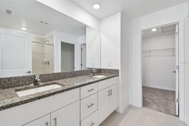 a view of a house with swimming pool and sitting area