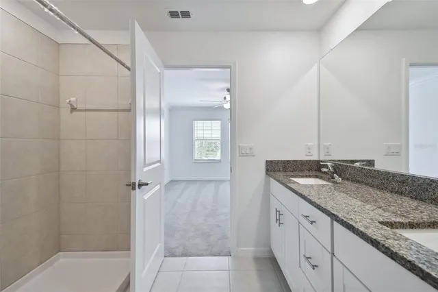 a view of a swimming pool with a table and chairs