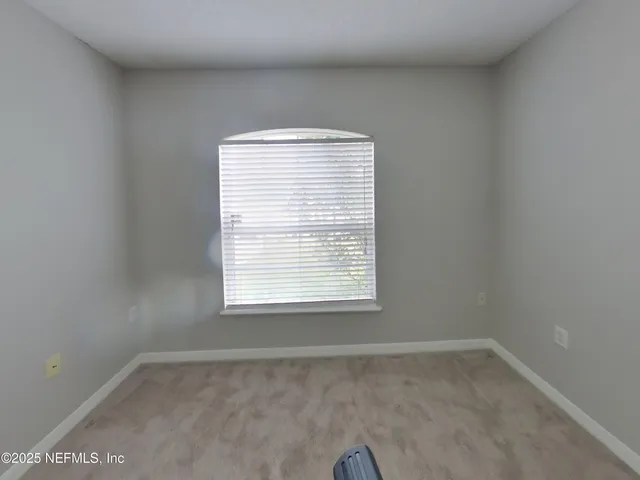 a view of a room that has a window in it