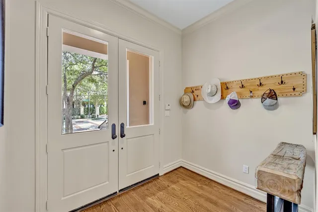 a view of a livingroom with wooden floor and a window
