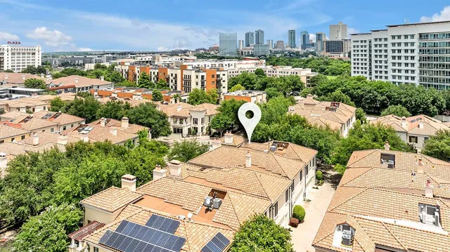 an aerial view of a house with a swimming pool and garden view