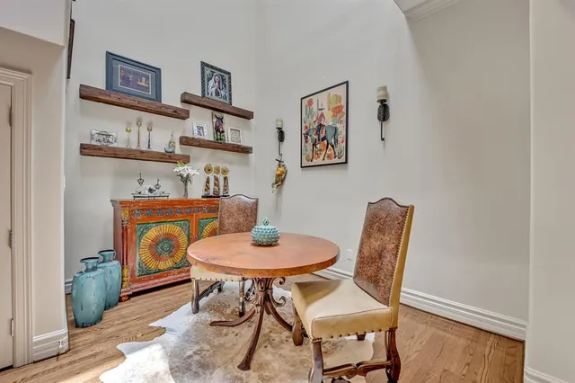 a dining room with furniture and wooden floor