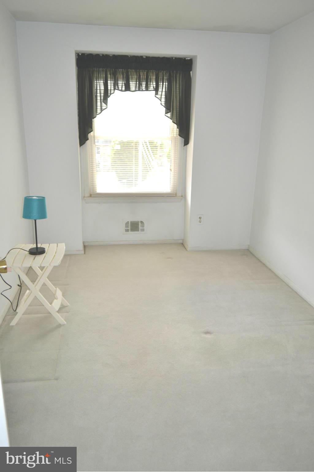 2136 Cockspur Road Baltimore, MD 21220 - Photo 11 of 20 a view of an empty room with a window